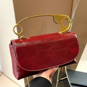 NWOT Elegant Burgundy Clutch with Gold Handle